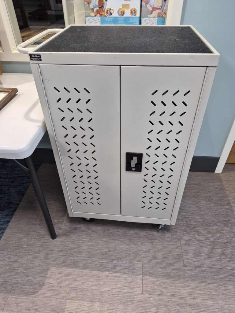 Laptop/Tablet tech cart with power, however back door is locked (still looking for the key) and will need a locksmith. Front is open. $100 minimum bid.